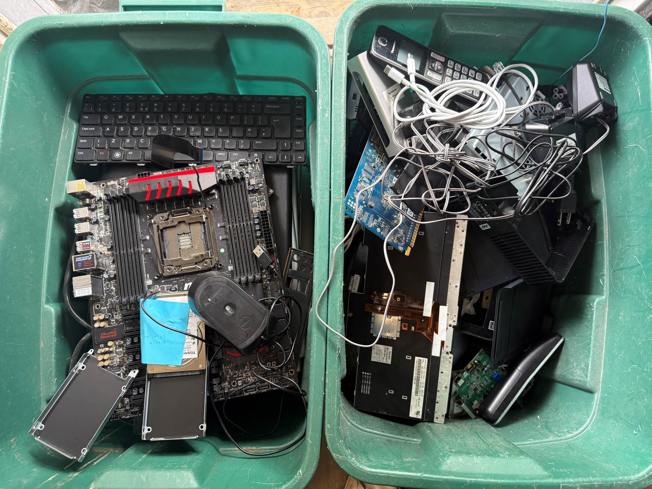 Recycling bins full of electronics components and motherboards