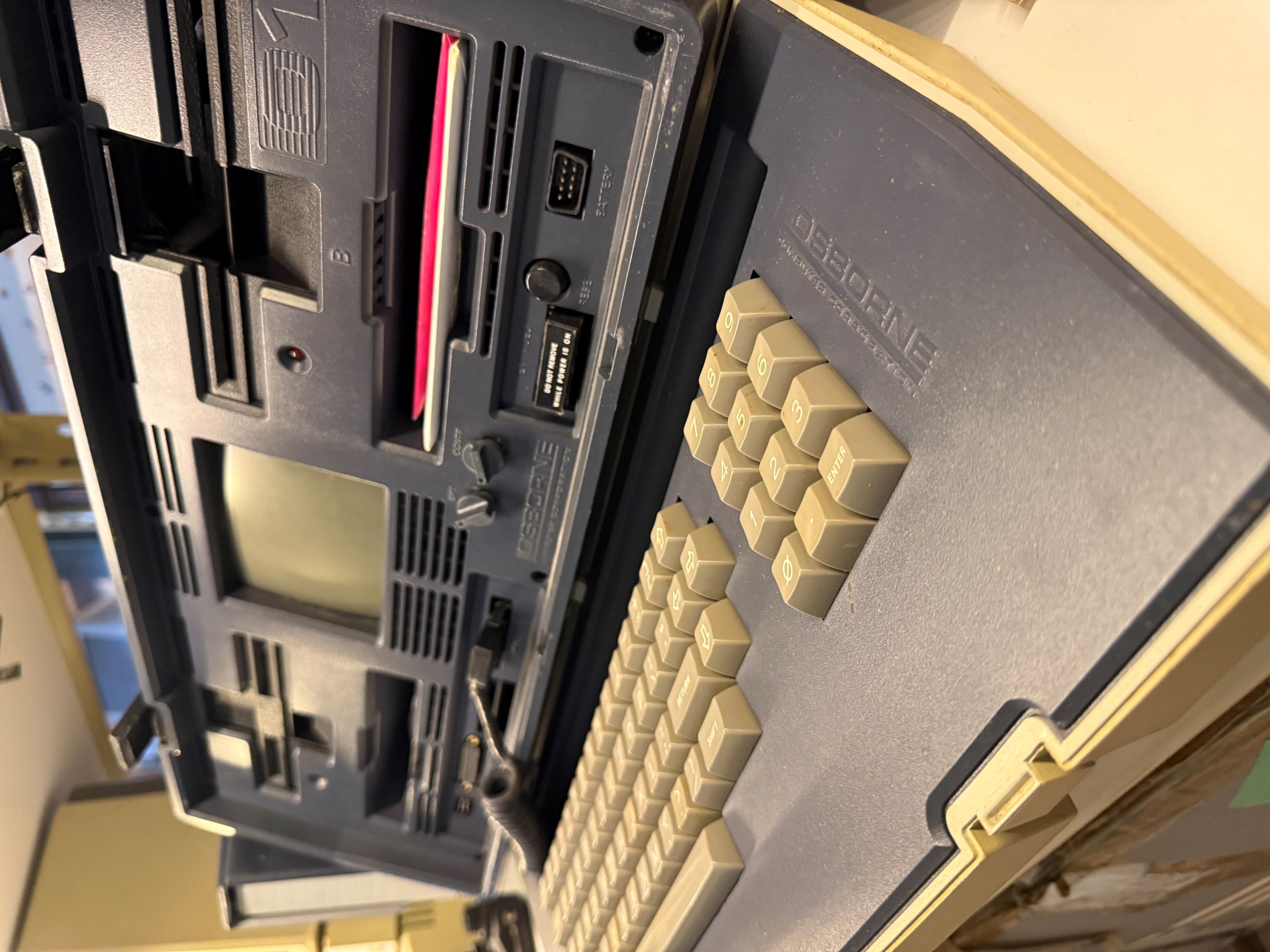 Osborne 1 portable computer open showing screen and keyboard