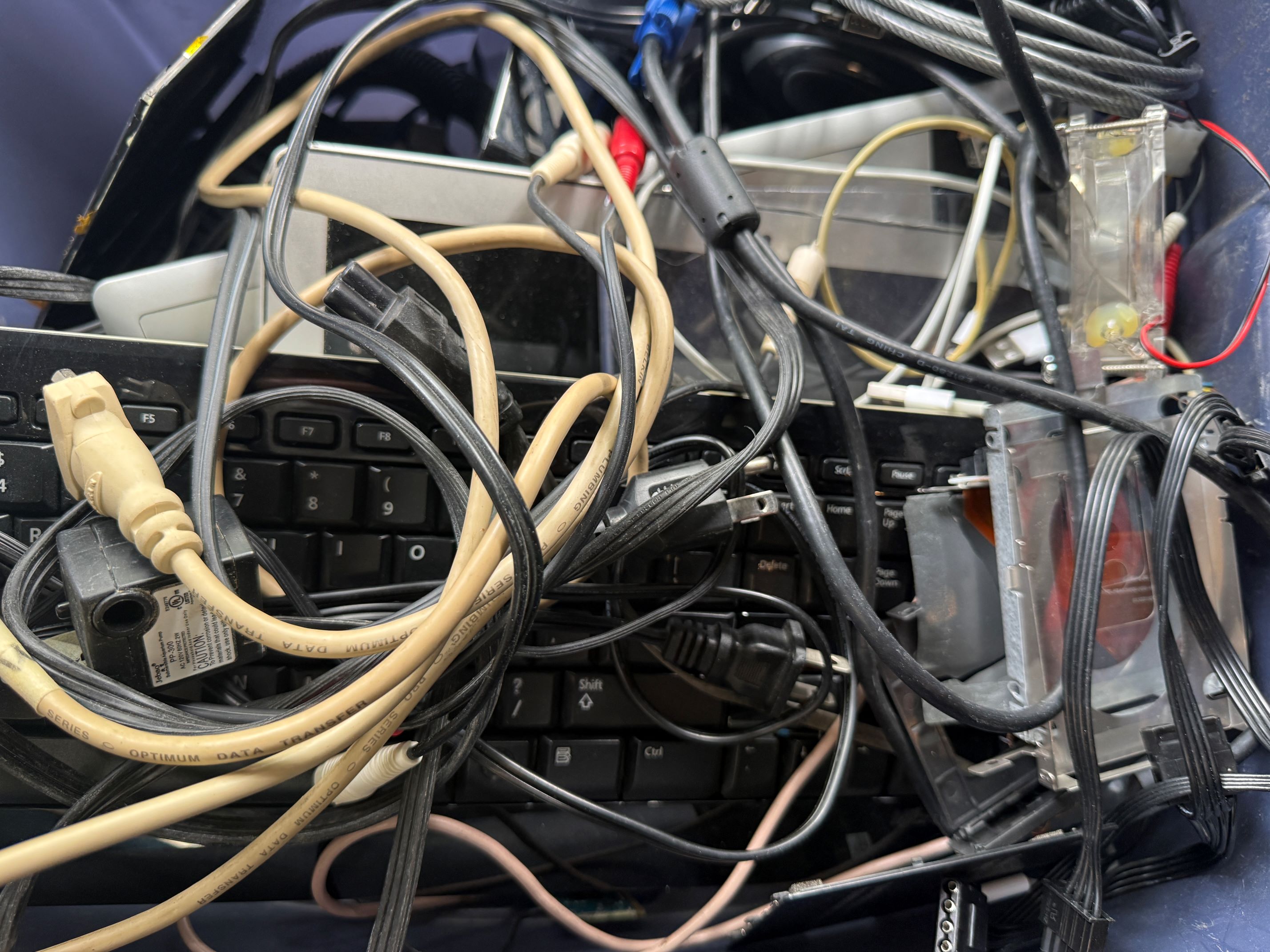 Tangled cables and power cords ready for recycling